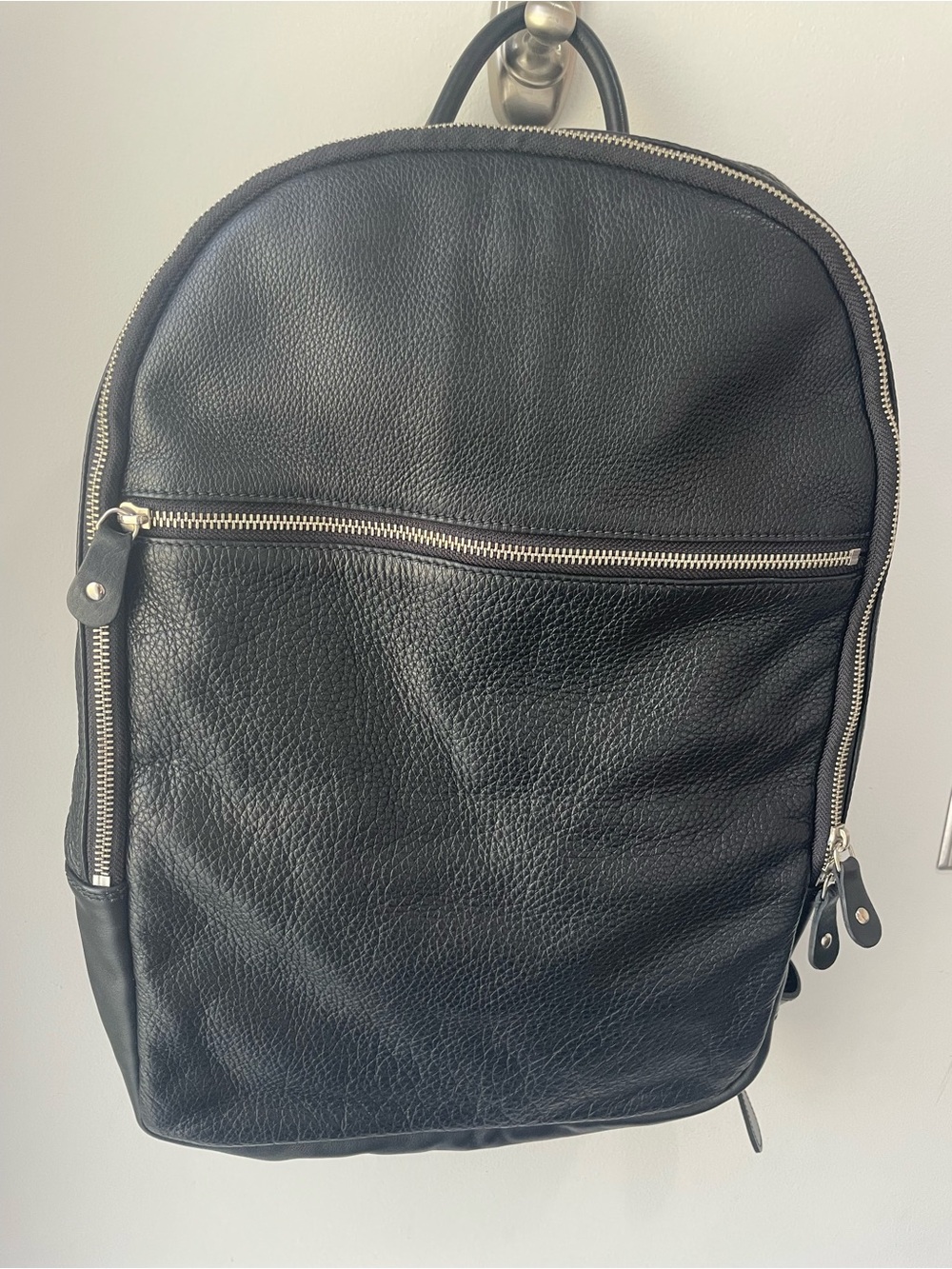 Roots Pebbled Black Leather Backpack with Silver Zippers